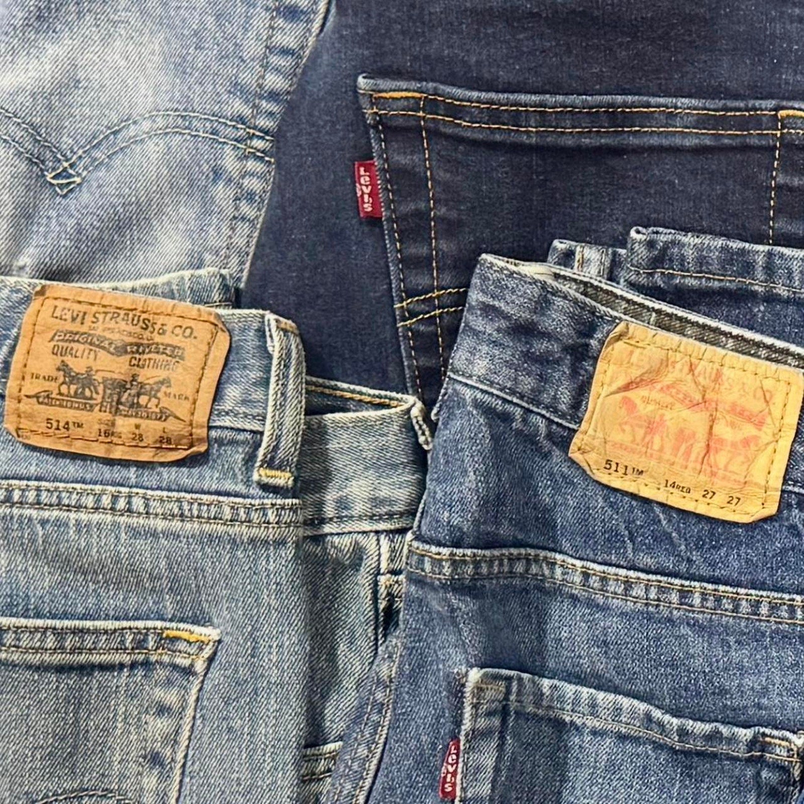 Levi’s bulk denim lot featuring 28 pairs in a variety of popular fits, washes, and sizes.