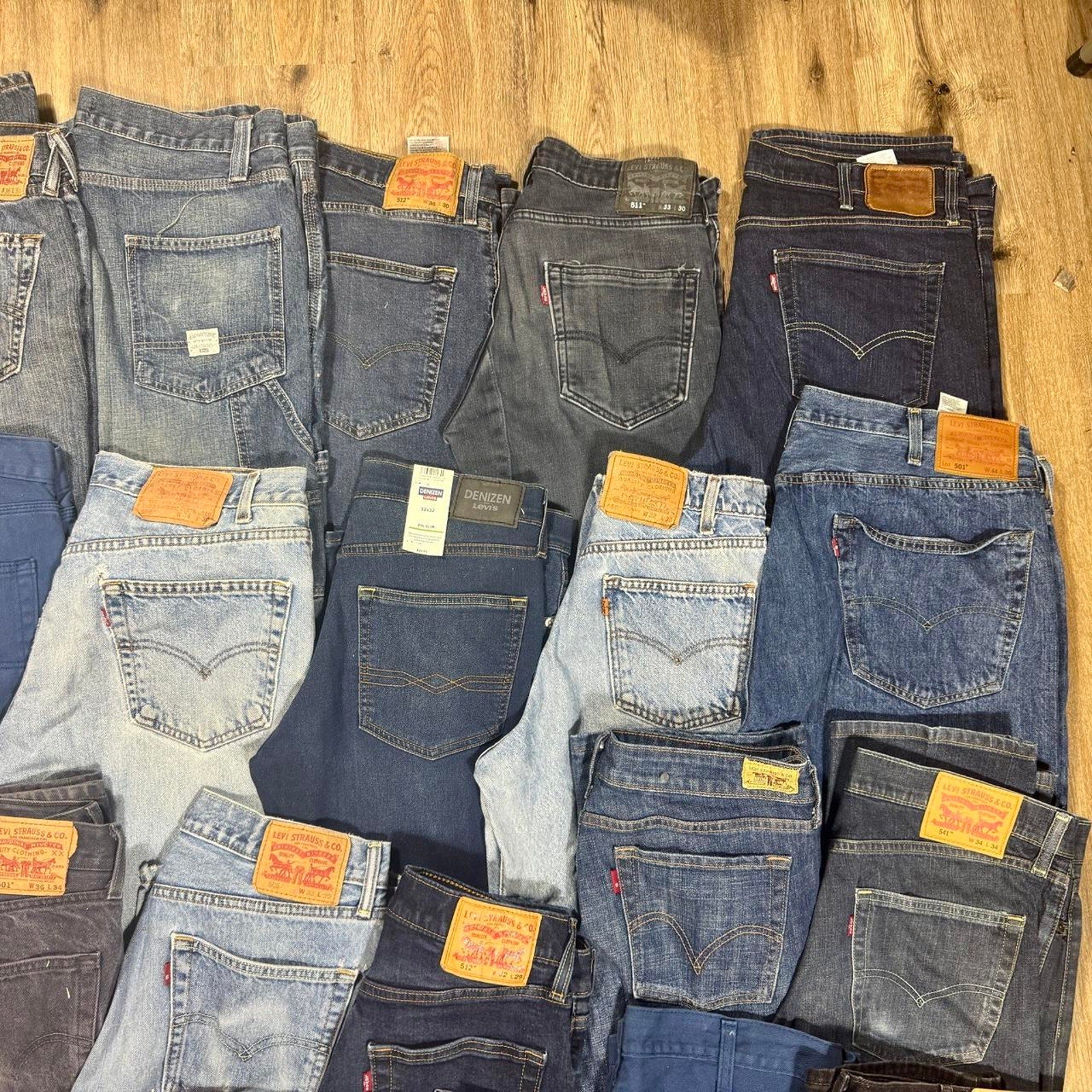 Levi’s bulk denim lot featuring 28 pairs in a variety of popular fits, washes, and sizes.