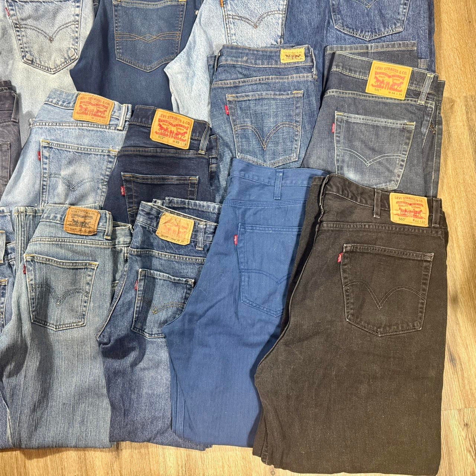 Levi’s bulk denim lot featuring 28 pairs in a variety of popular fits, washes, and sizes.