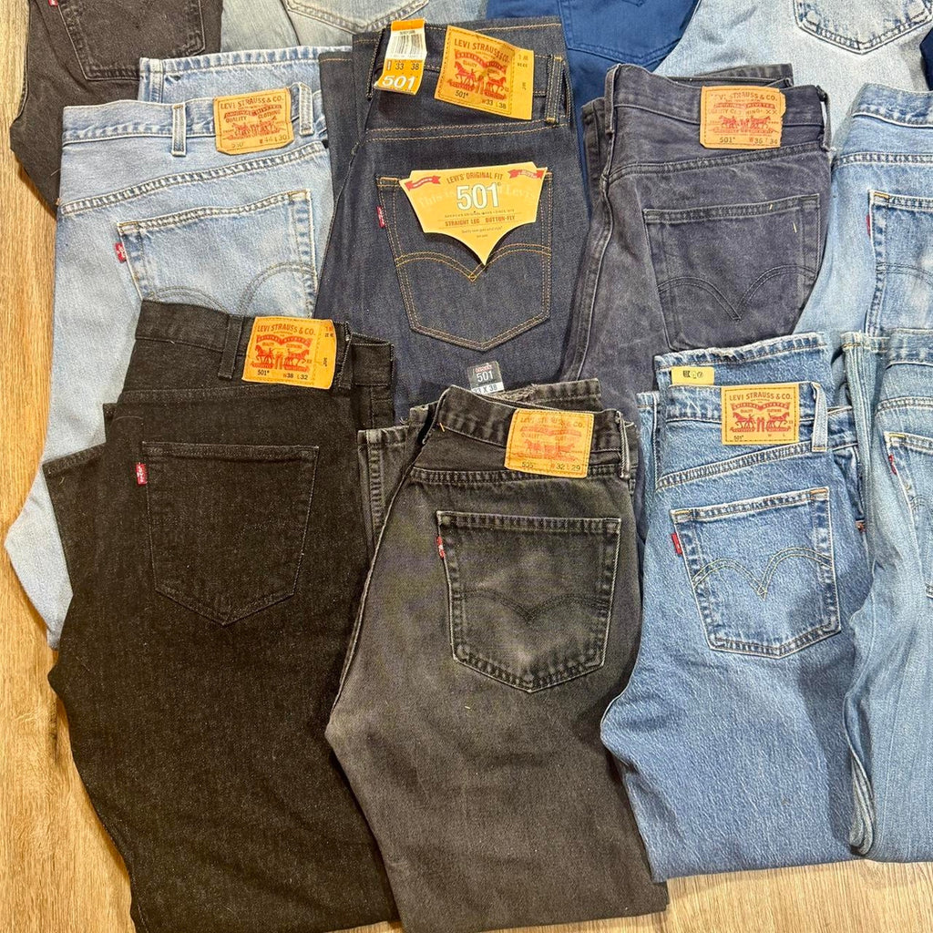 Levi’s bulk denim lot featuring 28 pairs in a variety of popular fits, washes, and sizes.